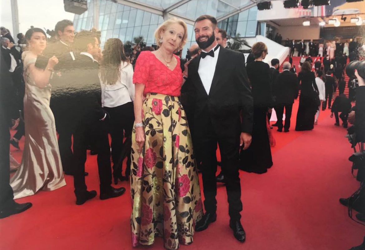 Francois DAGOMET on a red carpet with a VIP crowd in the background